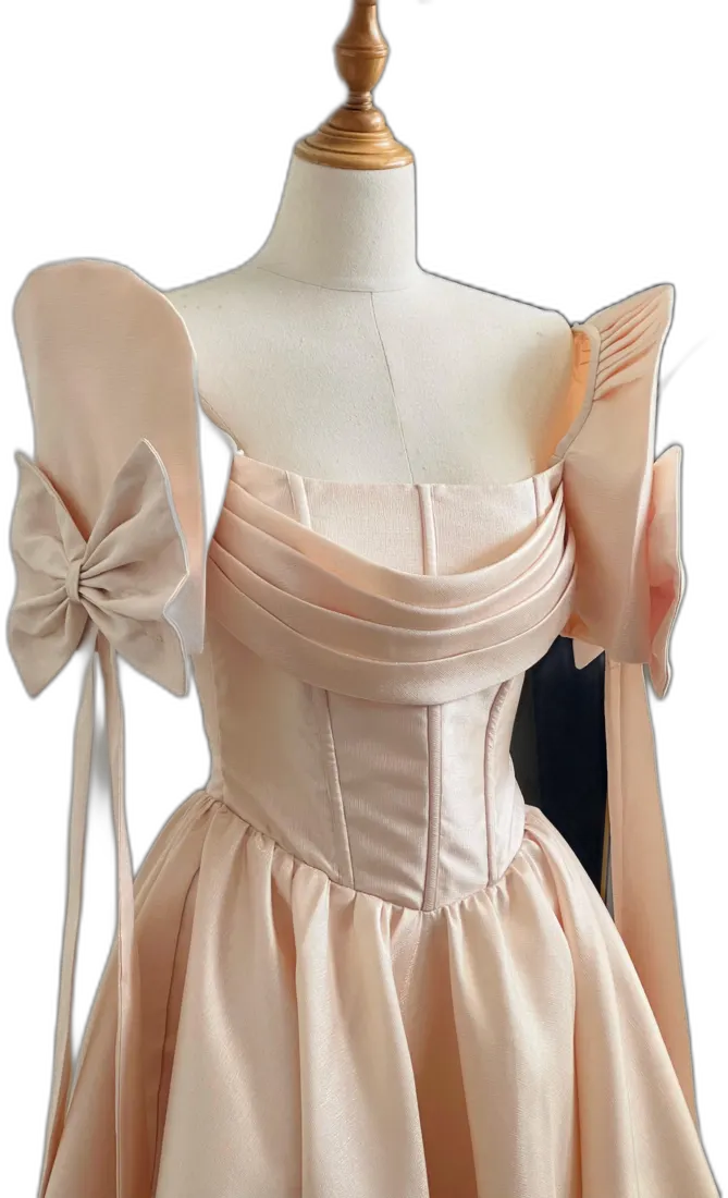 Peach satin gown with oversized bow