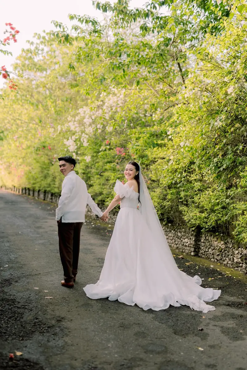 Couple on a tree-lined road