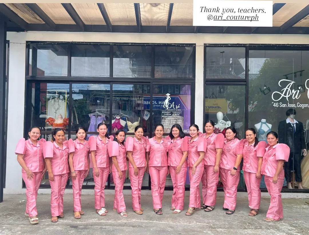 Teachers in matching pink outside the Ari Couture shop